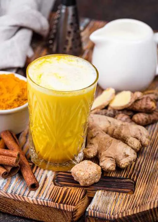 Ayurvedic golden milk with ginger Ayurvedic golden milk with ginger