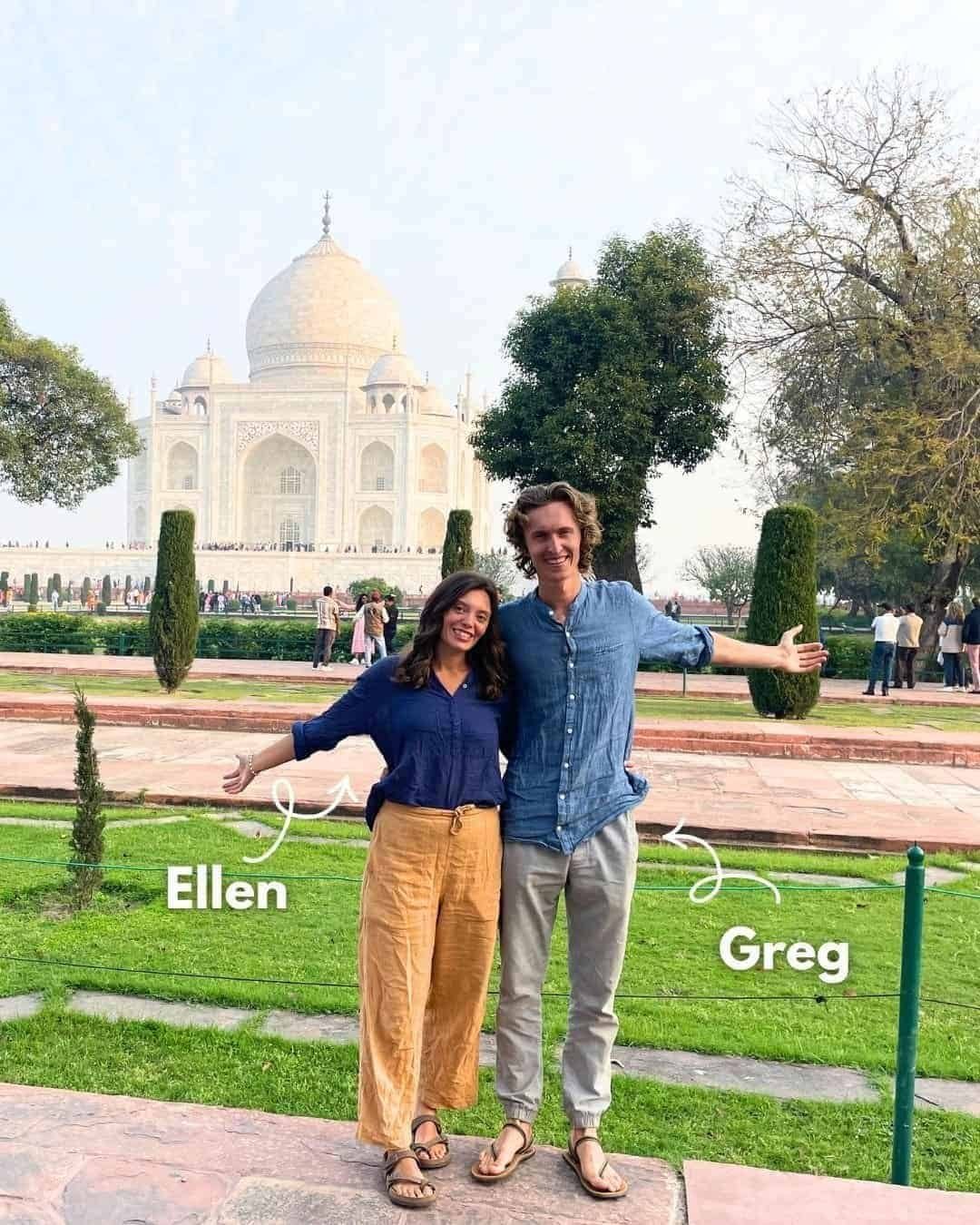 - Smiling couple standing in front of the Taj Mahal, with lush greenery and trees around, capturing a joyful moment.